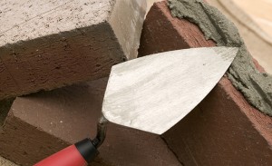 Korner laying bricks