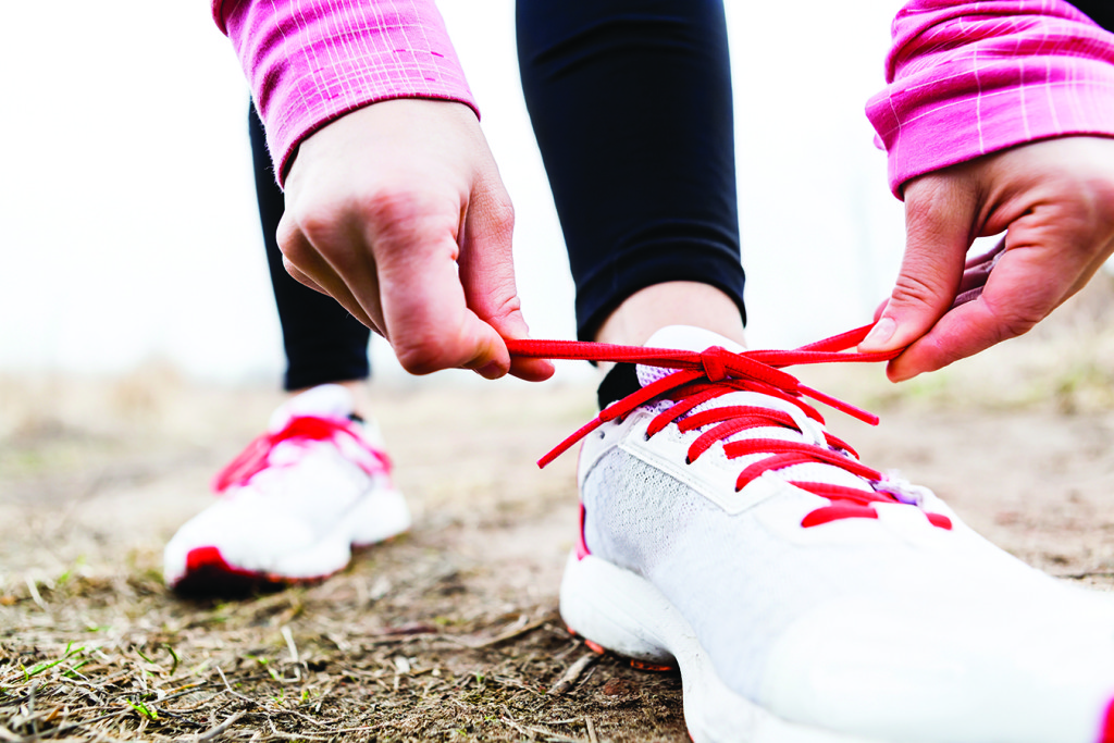 Walking or running legs in forest, adventure and exercising